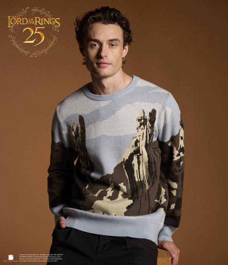Model wearing The Lord of the Rings 25 sweater with landscape graphic. Shop The Lord of the Rings.
