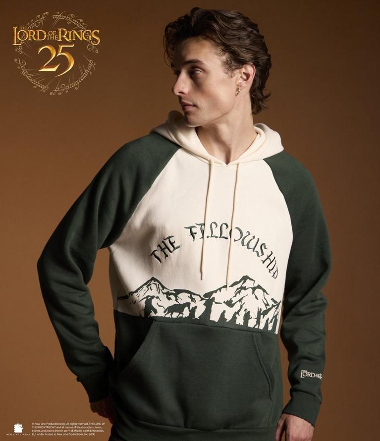 Model wearing The Lord of the Rings hoodie with “The Fellowship” mountain graphic. Shop The Lord of the Rings.