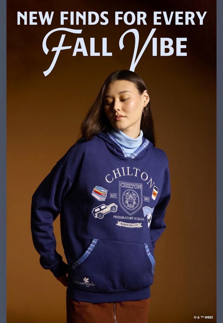 Model wearing a Chilton graphic hoodie with “NEW FINDS FOR EVERY FALL VIBE” text above. Shop by license.