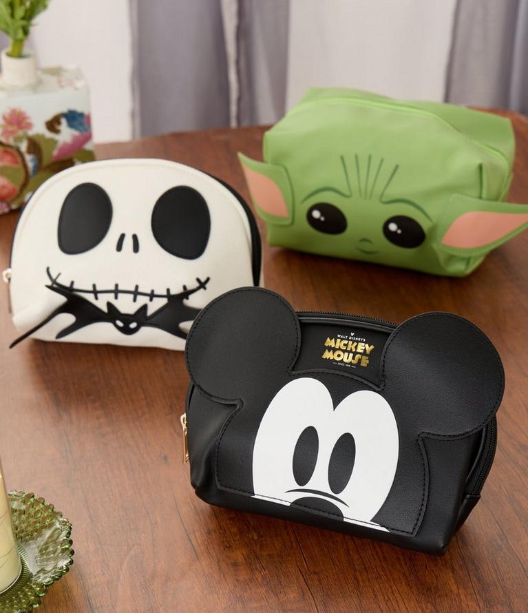 Three Disney character zip pouches, featuring Mickey Mouse, Grogu, and Jack Skellington. Shop beauty.