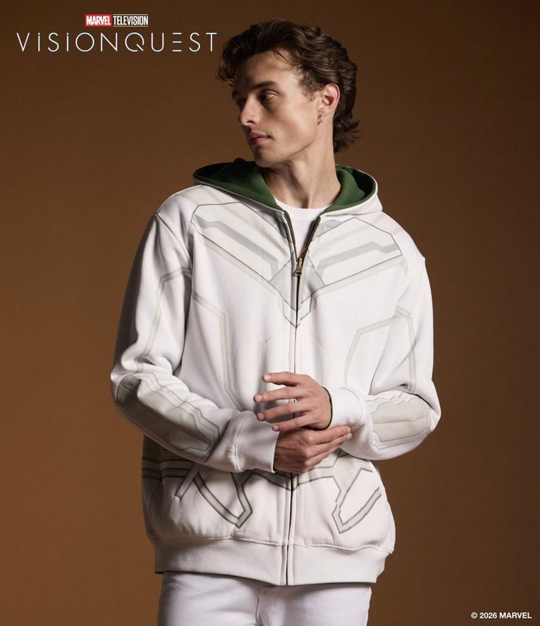 Model wearing a Marvel Vision Quest white zip-up hoodie with green hood lining and graphic print. Shop VisionQuest.