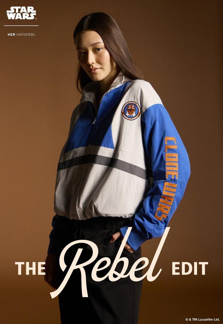 Model wearing Star Wars Her Universe jacket with “Clone Wars” sleeve text and patch. Shop Star Wars.