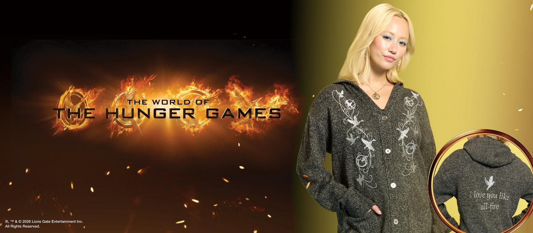 Model wearing The Hunger Games hooded cardigan with bird embroidery and back text, “I love you like all fire”. Shop The Hunger Games collection.