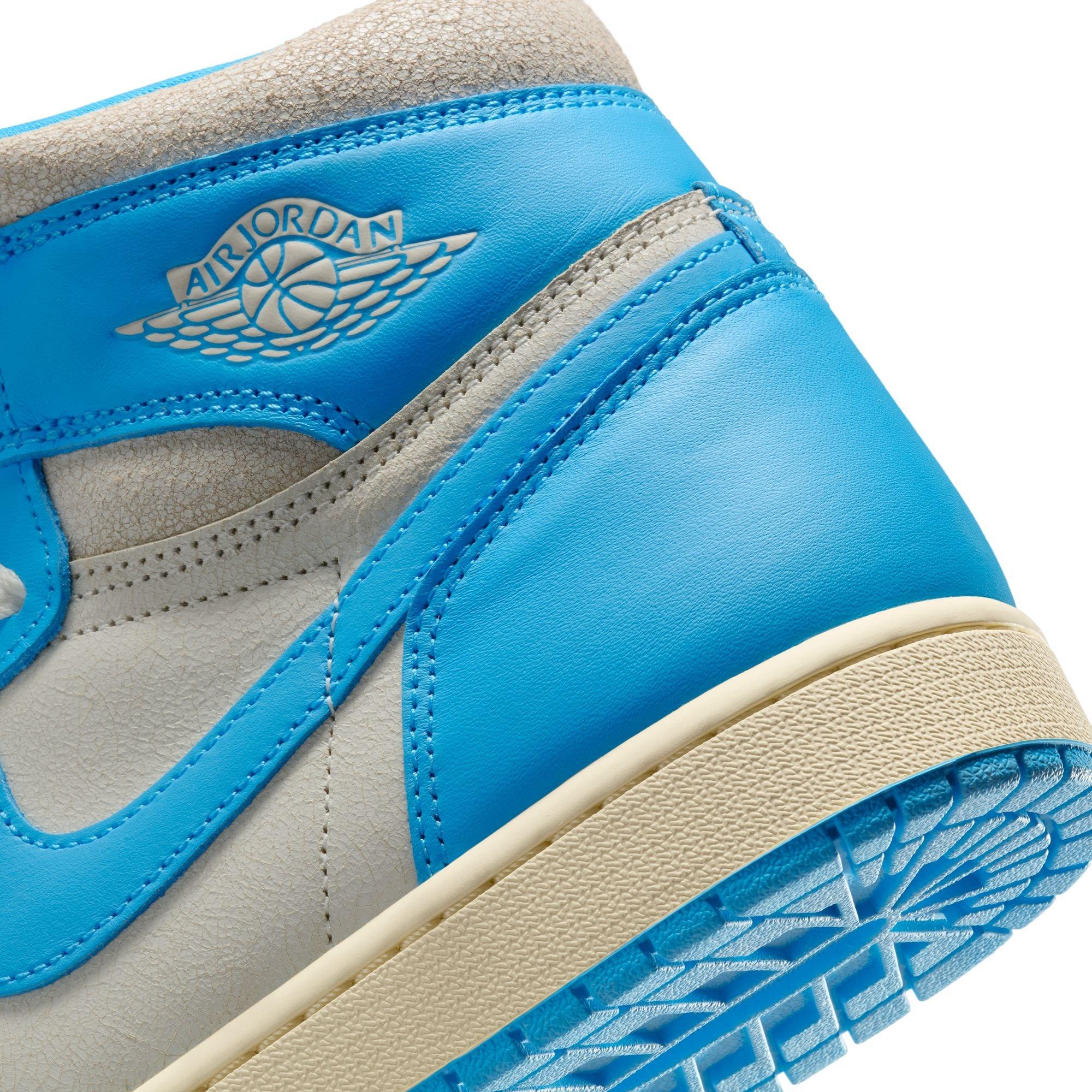 Jordan 1 High OG "UNC Reimagined" woman standing in sneakers