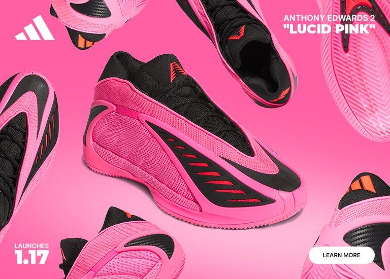 An advertisement for the adidas Anthony Edwards 2 Lucid Pink basketball shoe, featuring a vibrant pink upper with black accents and a futuristic, aerodynamic design. The text indicates a launch date of 1.17.