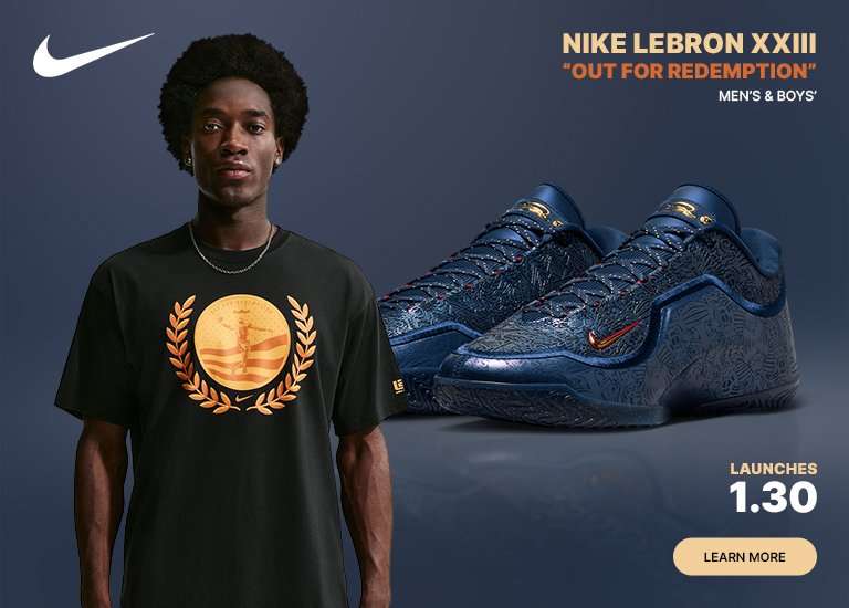 Promo banner for Nike LeBron XXIII Out For Redemption. On the left, a man wears a black t-shirt featuring a gold laurel wreath graphic. On the right, a pair of navy blue basketball shoes with intricate textured patterns are displayed. Text includes the Nike swoosh, product name, and a launch date of January 30.