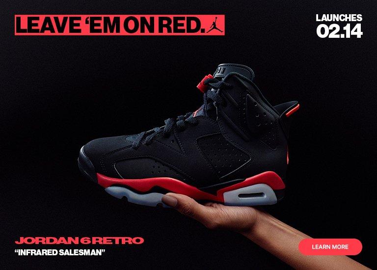 A hand holding a black and Infrared red Air Jordan 6 Retro sneaker against a black background. The text reads LEAVE 'EM ON RED, JORDAN 6 RETRO 'INFRARED SALESMAN', and LAUNCHES 02.14.
