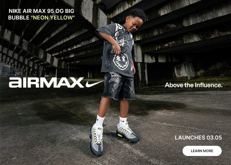 A promotional banner for the Nike Air Max 95 OG Big Bubble "Neon Yellow" for kids. The image features a young boy in streetwear and a close-up of the sneakers, which showcase the iconic grey gradient design with vibrant neon yellow accents. Text includes the slogan "Above the Influence" and a launch date of 03.05.