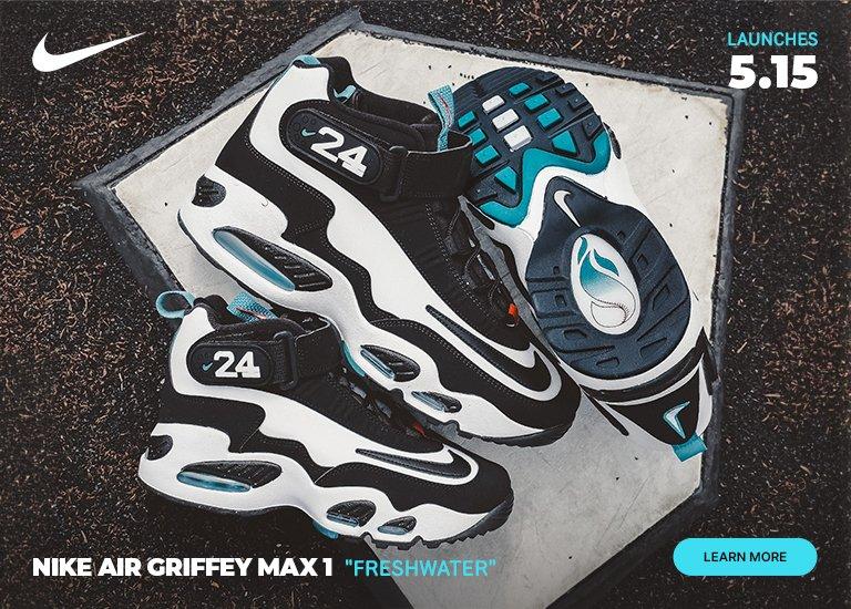 Nike Air Griffey Max 1 "Freshwater" sneakers in black, white, and teal on a baseball field background. The image includes text indicating a May 15 launch date.