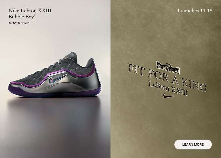 Advertisement for the Nike LeBron XXIII Bubble Boy men's and boys' shoe (dark gray/purple/silver). The ad states the shoe Launches 11.18 and features the text FIT FOR A KING. A LEARN MORE button is visible.
