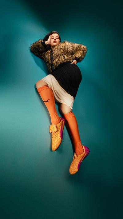 Woman in Puma x Fenty Sneakers