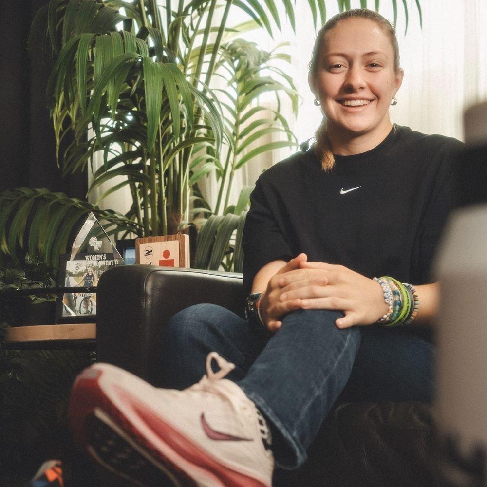 Adrienne Bunn sitting on couch