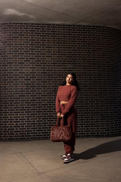 Woman in Nike Dunks and Nike Apparel