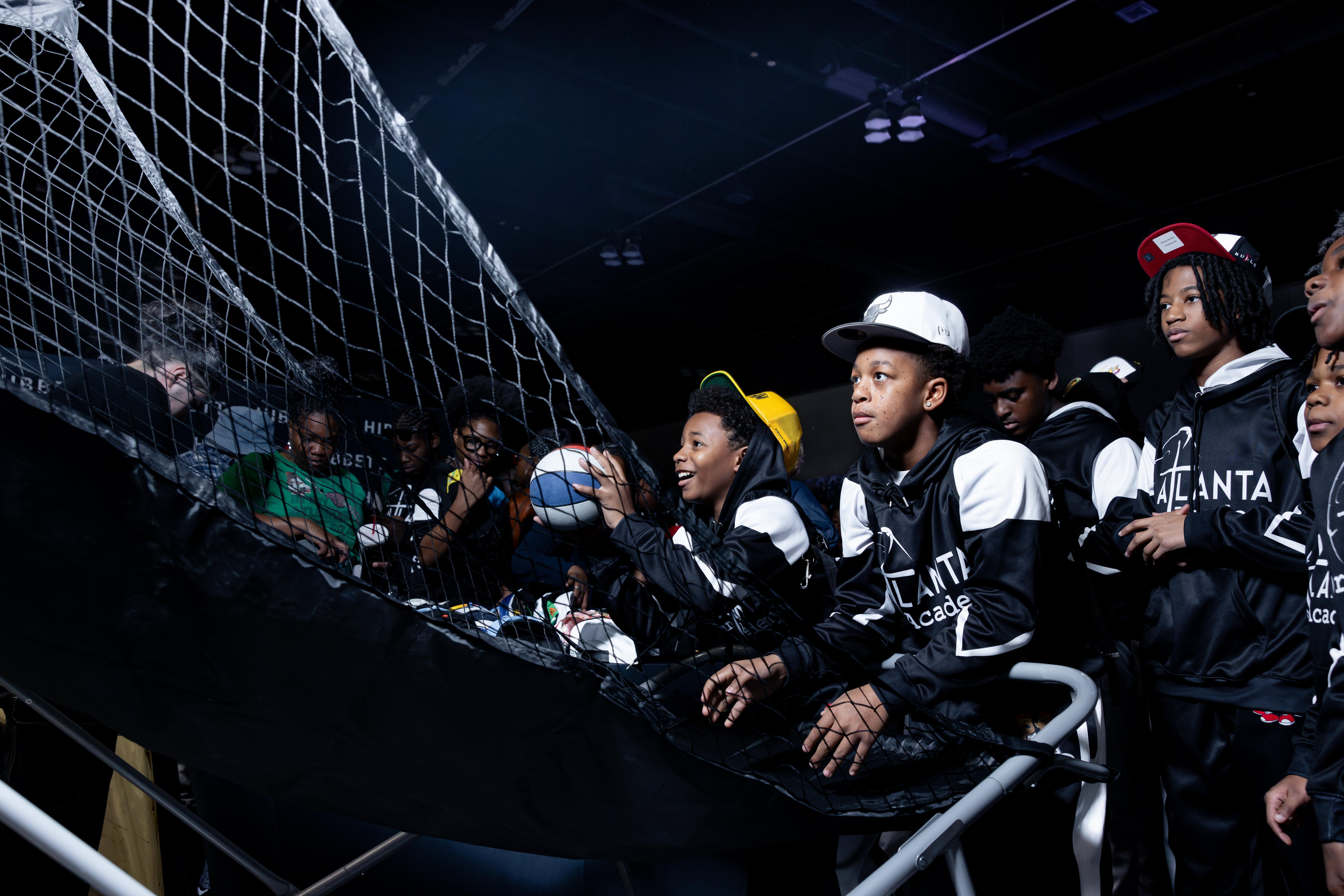 Hibbett at Legacy Fest 2025 Boy Playing Basketball Shooting Arcade Game