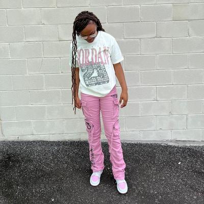 Woman in Jordan Heritage Gel shirt