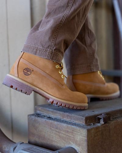 A close-up shot of a with Timberland boots on