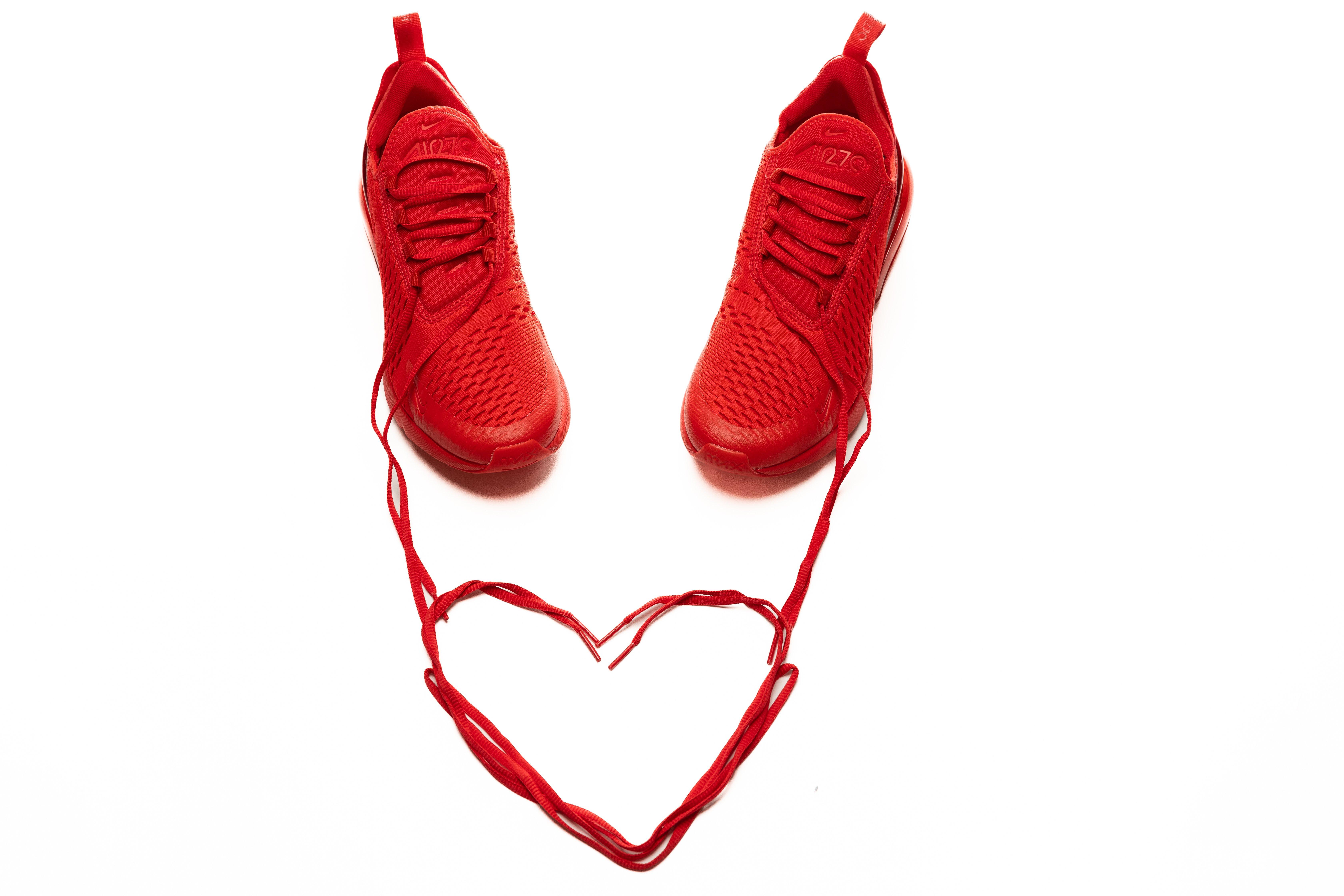 Red/Red Air Max 270 sneakers with laces in the shape of a heart.