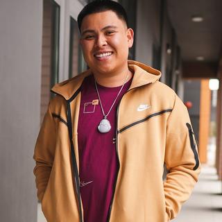 Alex Walter posing in Nike Tech Fleece and Tee