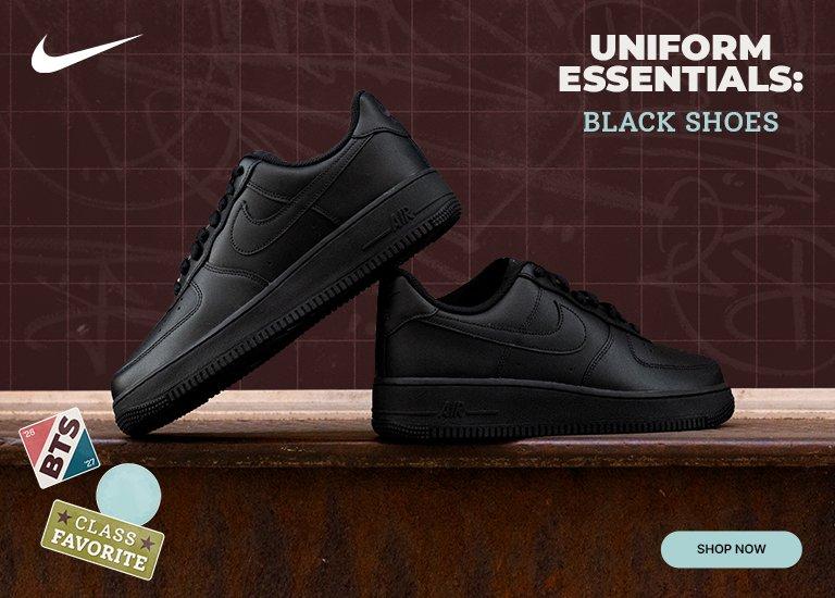 Black Nike sneakers displayed against a school-themed backdrop, highlighting black shoes as a uniform essential with a shop now button.