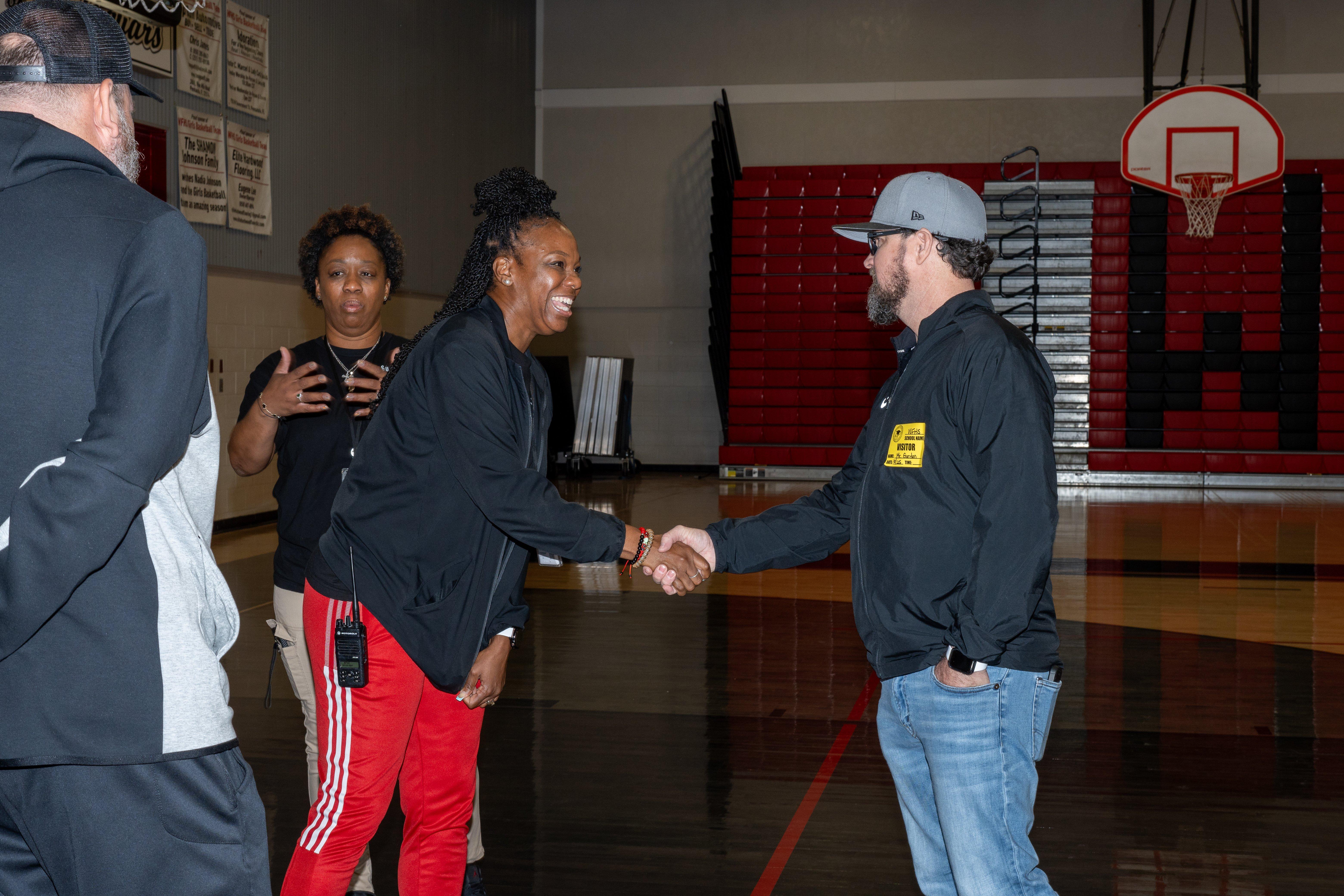 Hibbett store representatives with coach