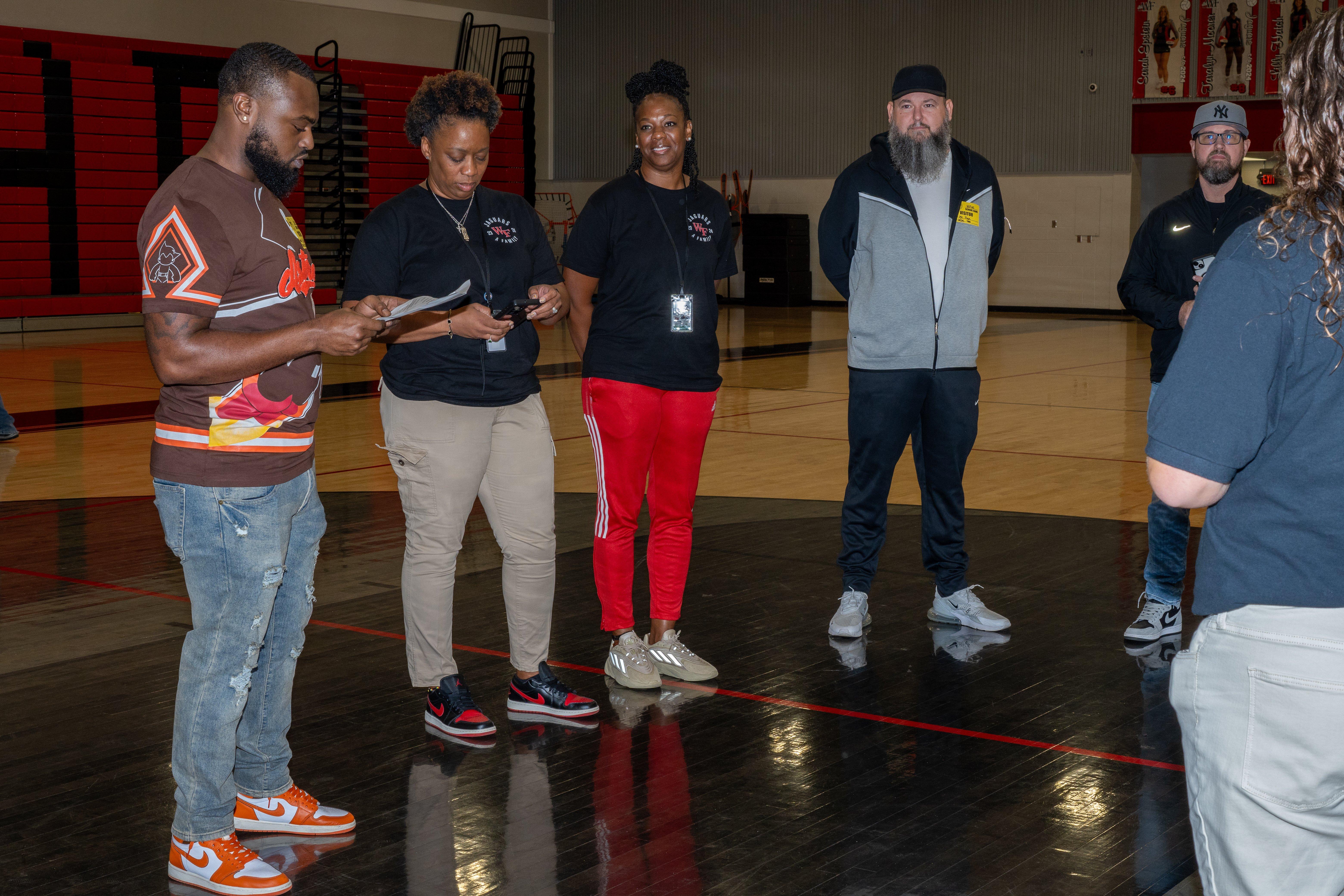 Hibbett reps greeting coach