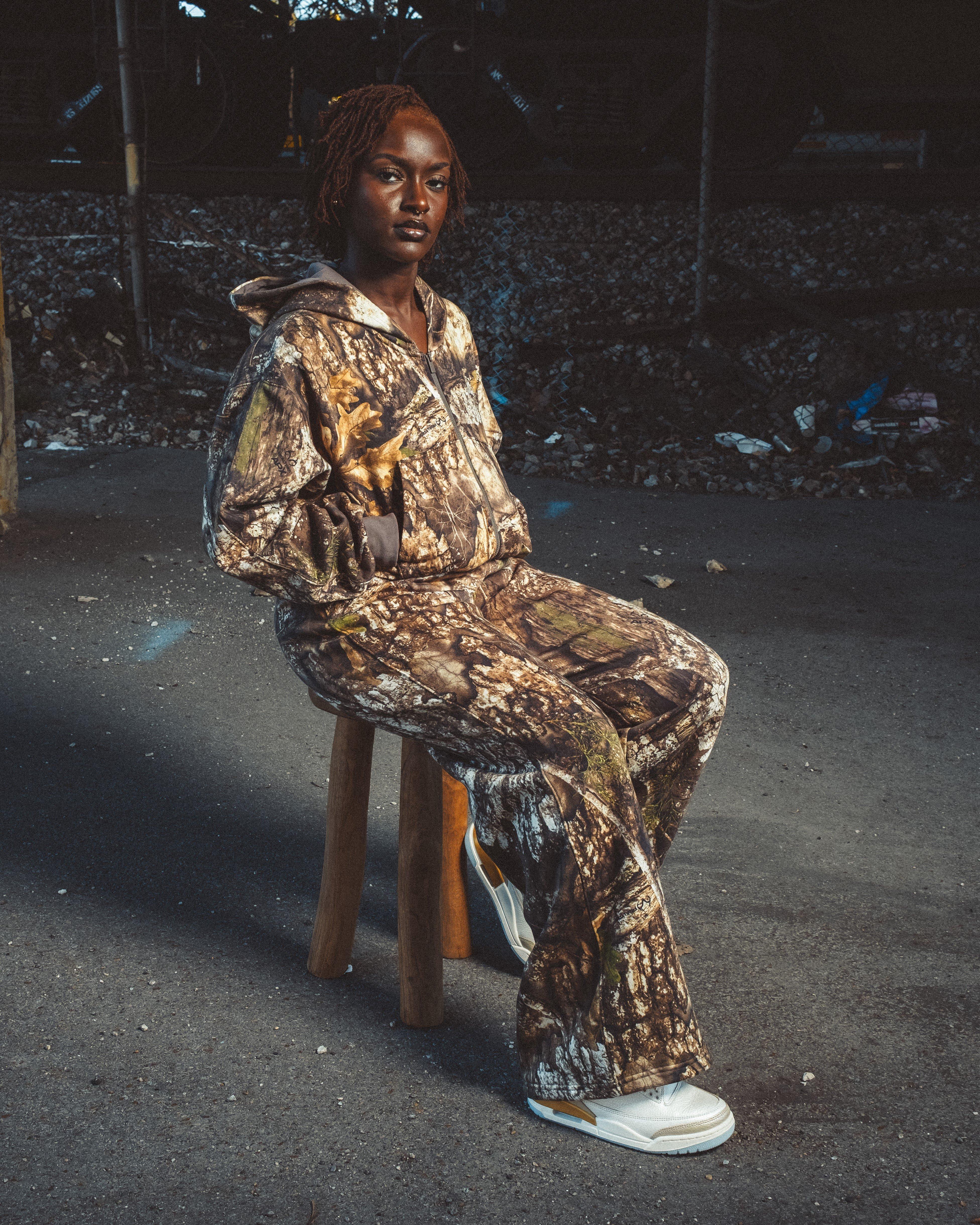 woman sitting in Jordan 3 "Sail and Pale Ivory"