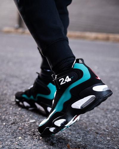 Young man in black joggers and Nike Air Griffey Max 1 "Freshwater" sneakers