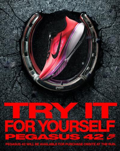Nike Pegasus 42 in road pothole surrounded by a horseshoe. Trial the shoe yourself. 