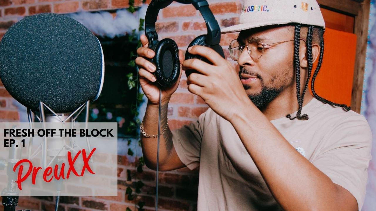 PreuXX in studio with mic