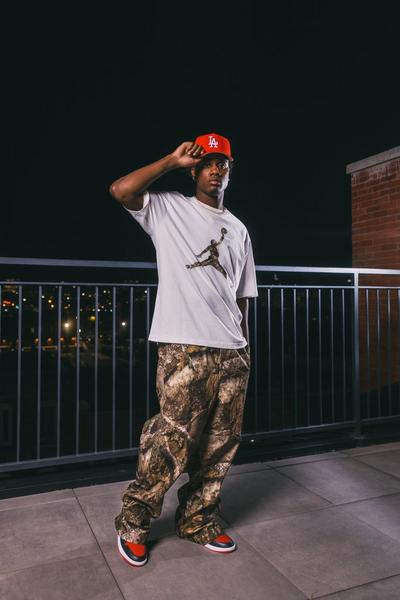 Woman in Jordan Heritage Gel shirt