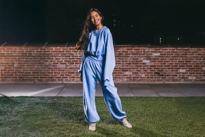 Young woman in adidas apparel and sneakers