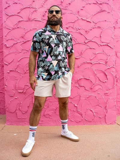 Man wearing Chubbies Khakinator shorts and printed button-down shirt