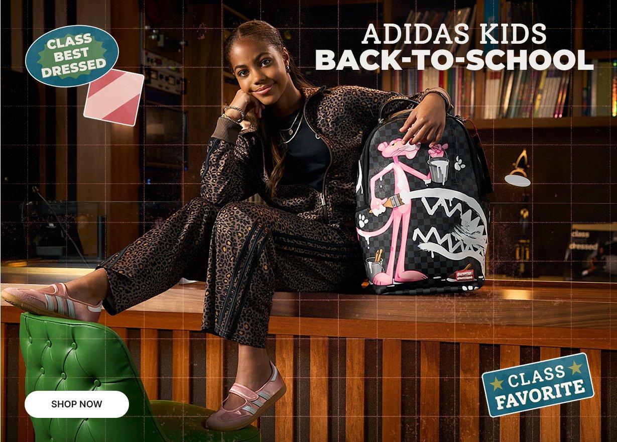 Adidas Kids Back-to-School collection featuring a leopard-print track suit and sneakers in a retro library setting.