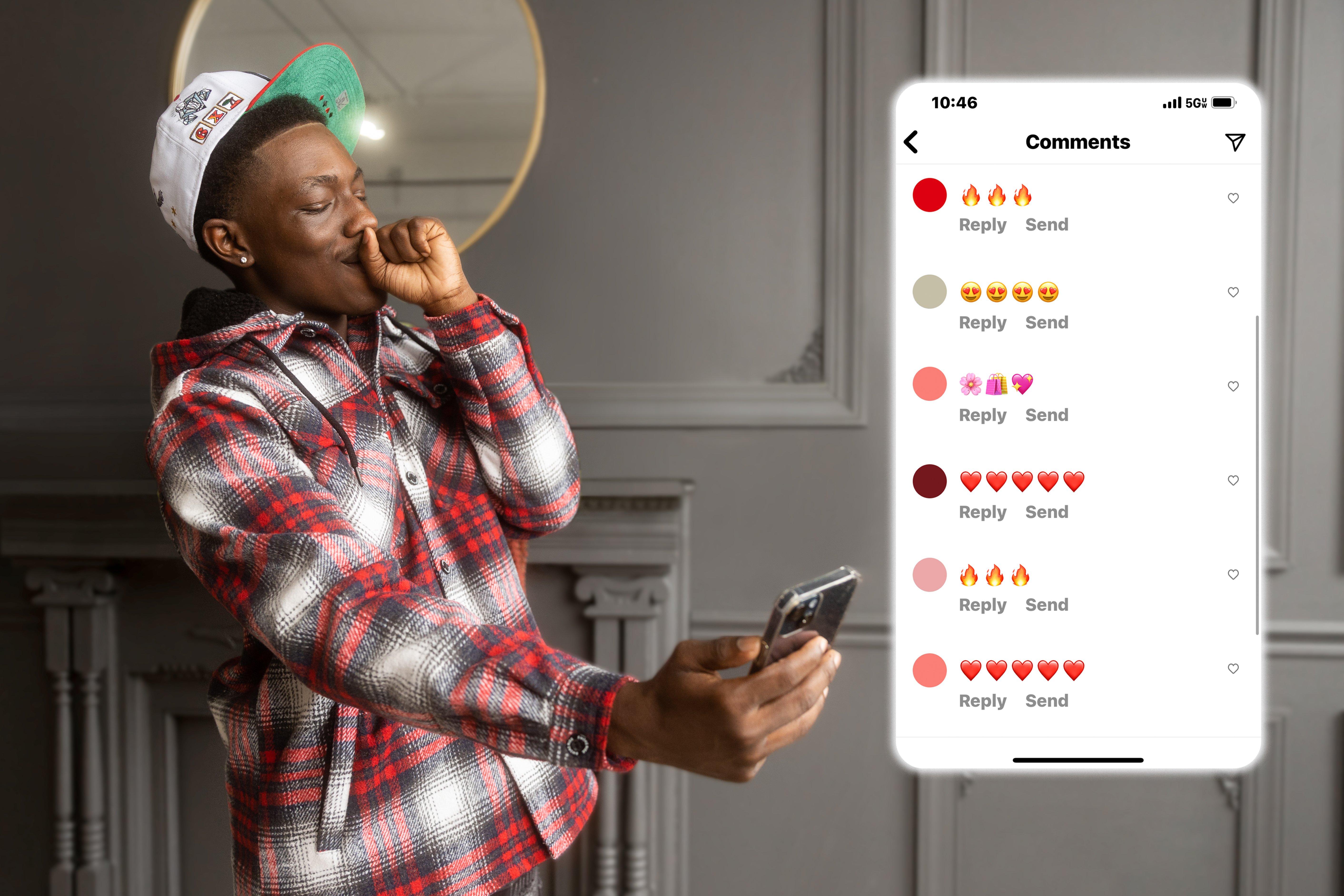 Man in streetwear apparel looking at his cell phone admiring comments on a social media post.