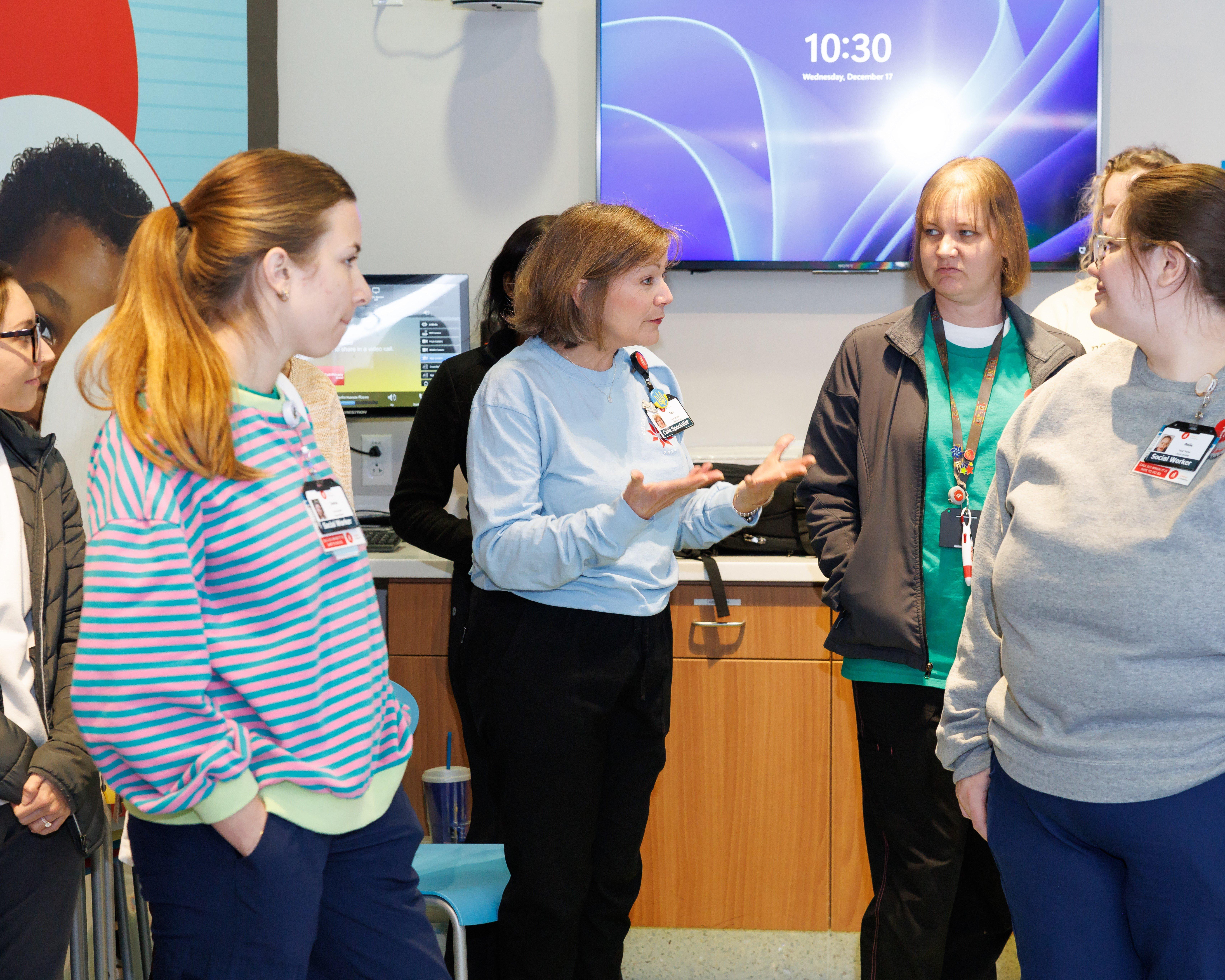 Woman speaking to a group of people