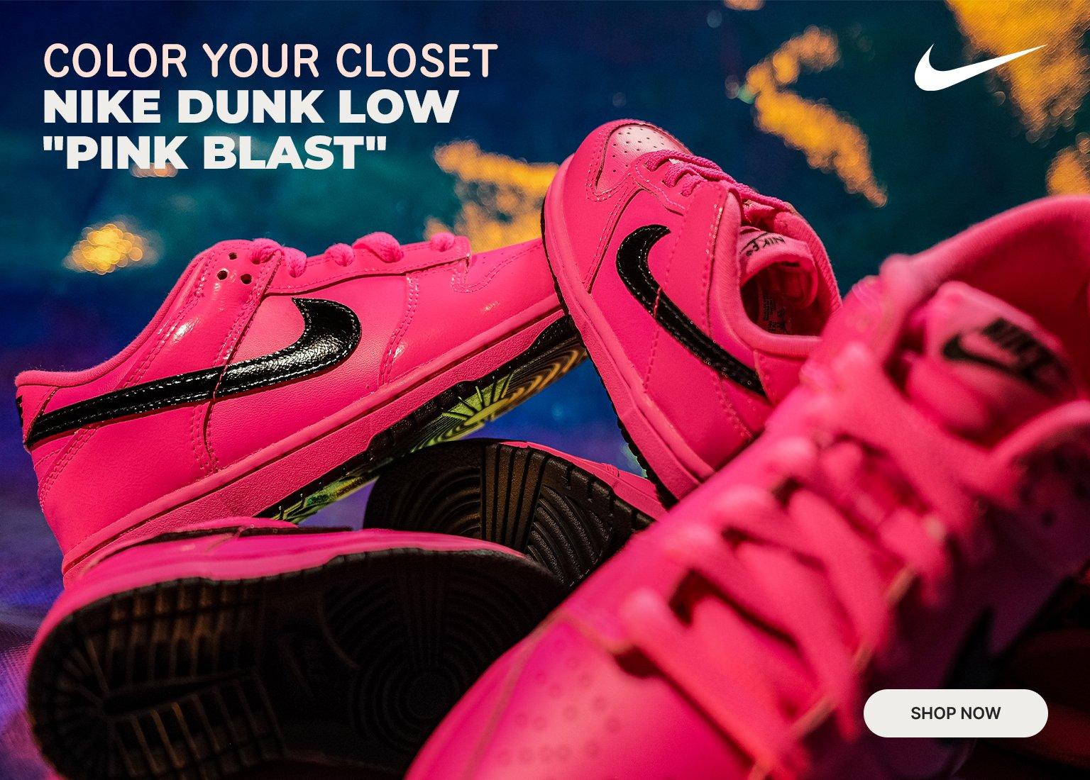 Promotional mobile banner featuring a cluster of vibrant hot pink Nike Dunk Low "Pink Blast" sneakers with glossy black Swooshes. Text reads, "Color Your Closet. Nike Dunk Low 'Pink Blast'" alongside a white Nike Swoosh logo and a "Shop Now" button.