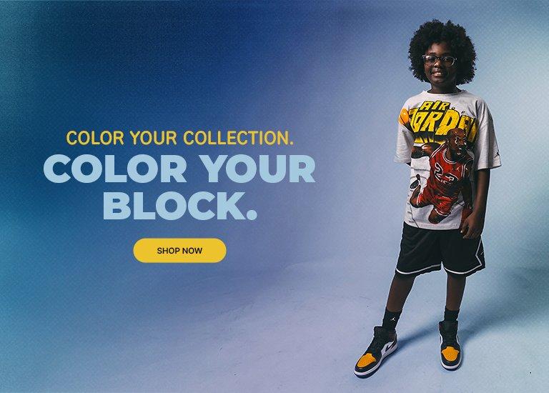 Child wearing a Jordan graphic tee and black shorts stands beside a large Air Jordan sneaker, with text reading “Color Your Collection. Color Your Block.” and a “Shop Now” button.