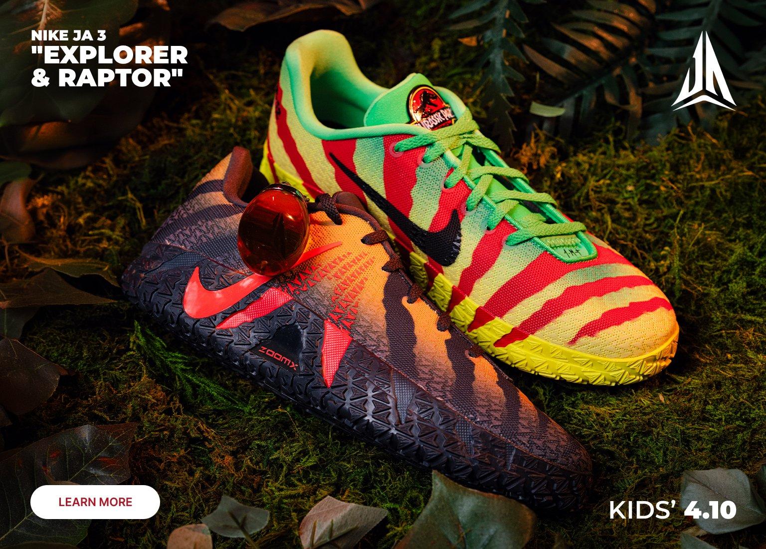 Promotional banner for Kids’ Nike Ja 3 Explorer & Raptor sneakers featuring a Jurassic Park theme. The image displays the dinosaur-patterned shoes alongside a Jurassic Park branded crate and custom insoles against a jungle-like background. Text includes Learn More and a release date of Kids' 4.10.