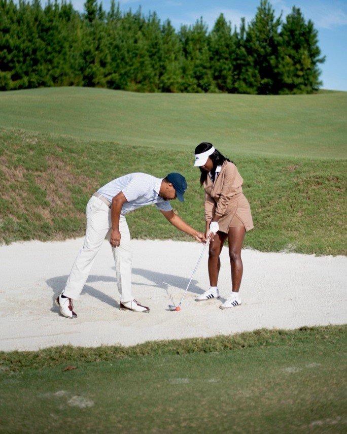 Keyeriah Miles and man golfing on golf course