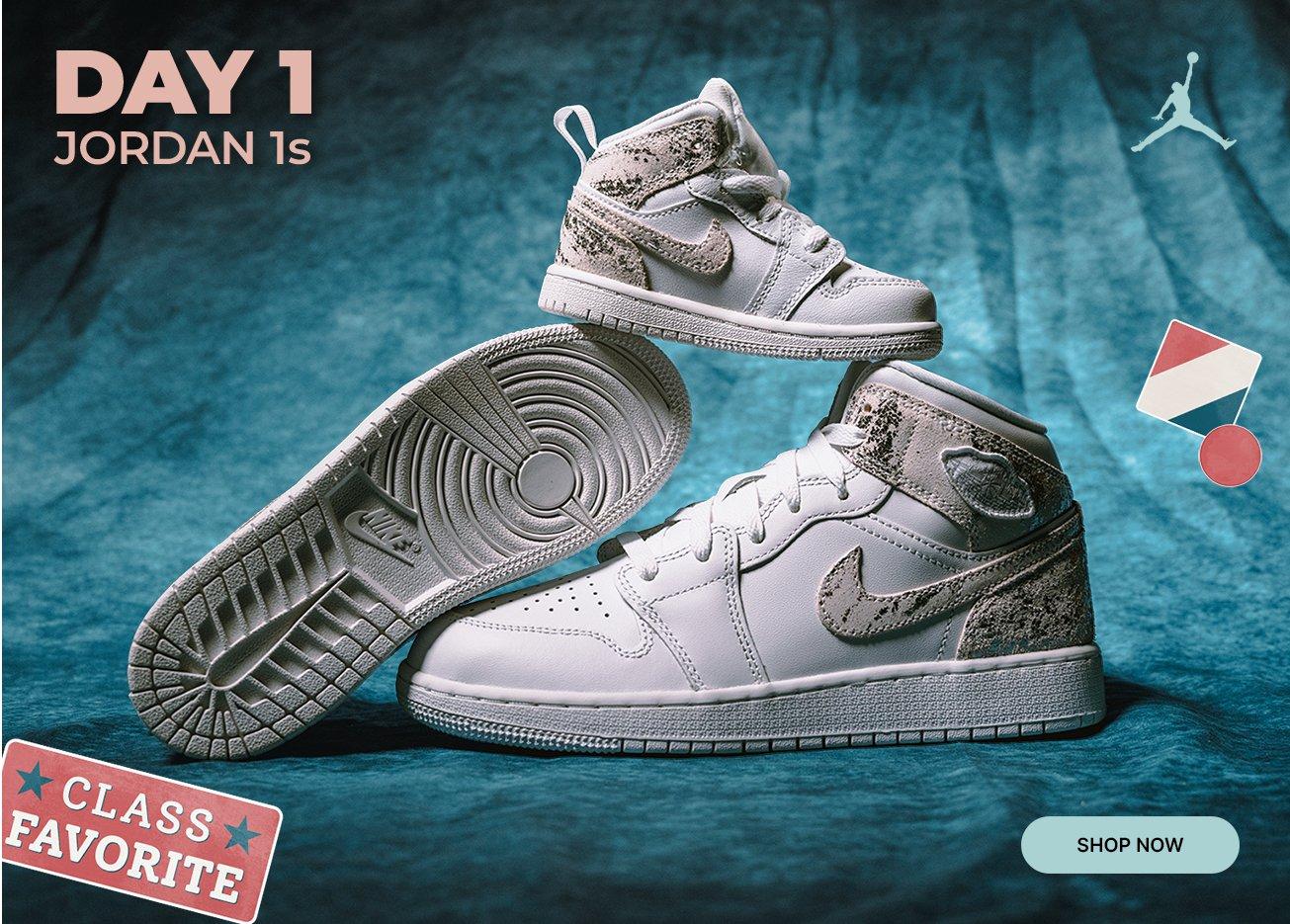 White and gray Air Jordan 1 sneakers displayed against a blue backdrop with Day 1 Jordan 1s promotion and Class Favorite badge.