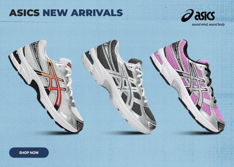 A promotional marketing image features three pairs of kids Asics GEL-1130 sneakers arranged diagonally on a textured light blue background. The top shoe features bright pink mesh with metallic silver overlays, the middle shoe shows dark grey mesh with silver overlays, and the bottom shoe has white mesh with a metallic orange and red gradient Asics stripe. The Asics logo and slogan sound mind, sound body are in the top left corner, and the text ASICS NEW ARRIVALS is centered at the bottom.
