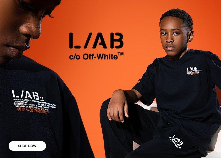 Close-up and full view of a kid wearing a black Off-White™ L.A.B graphic T-shirt and jogger set against a bright orange background, featuring white and orange logo details.