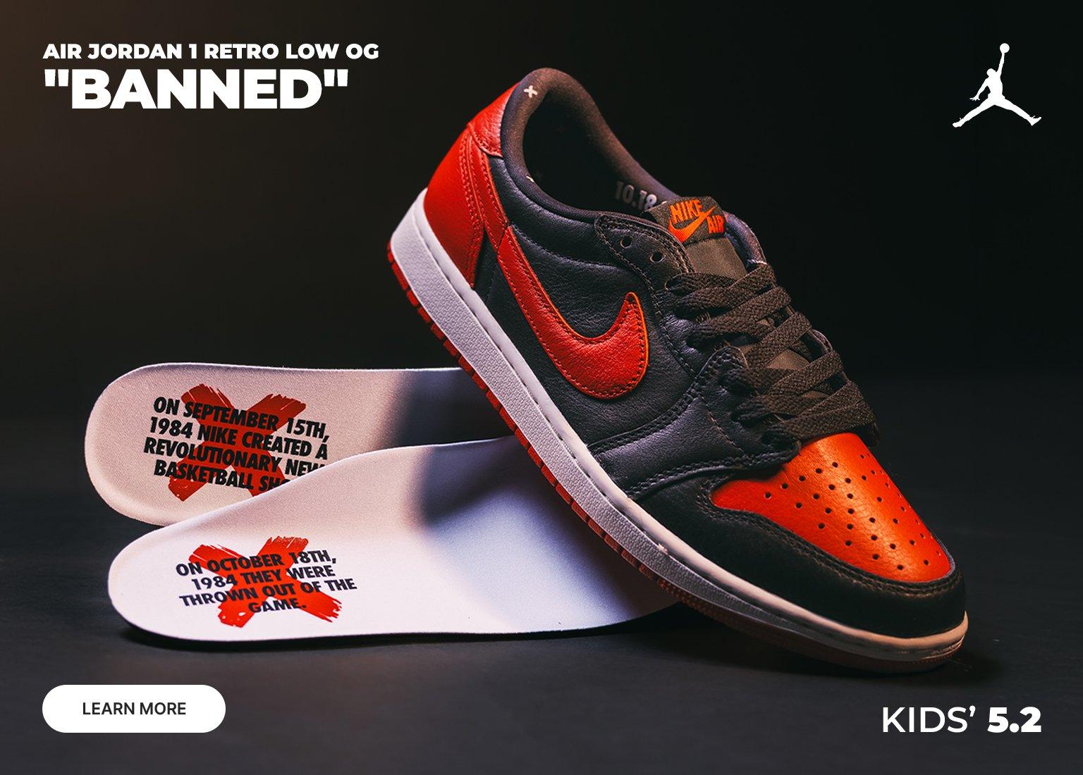 Kids’ Air Jordan 1 Retro Low OG “Banned” sneakers in black and red, with product details and “Learn More” call to action.