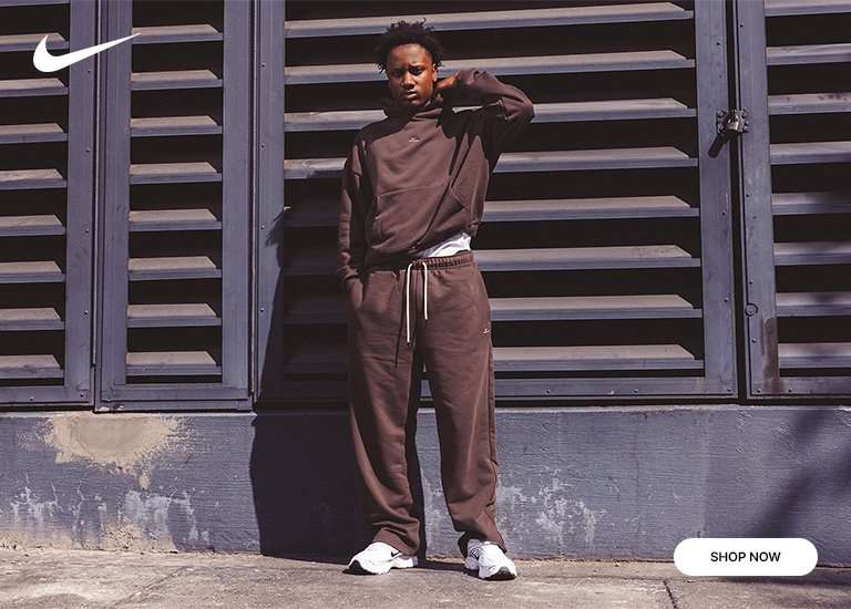 Nike ad featuring a man in a brown fleece tracksuit and a close-up of white running shoes.