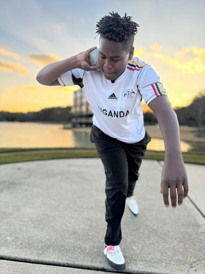 Moses Caldwell with shot put ball