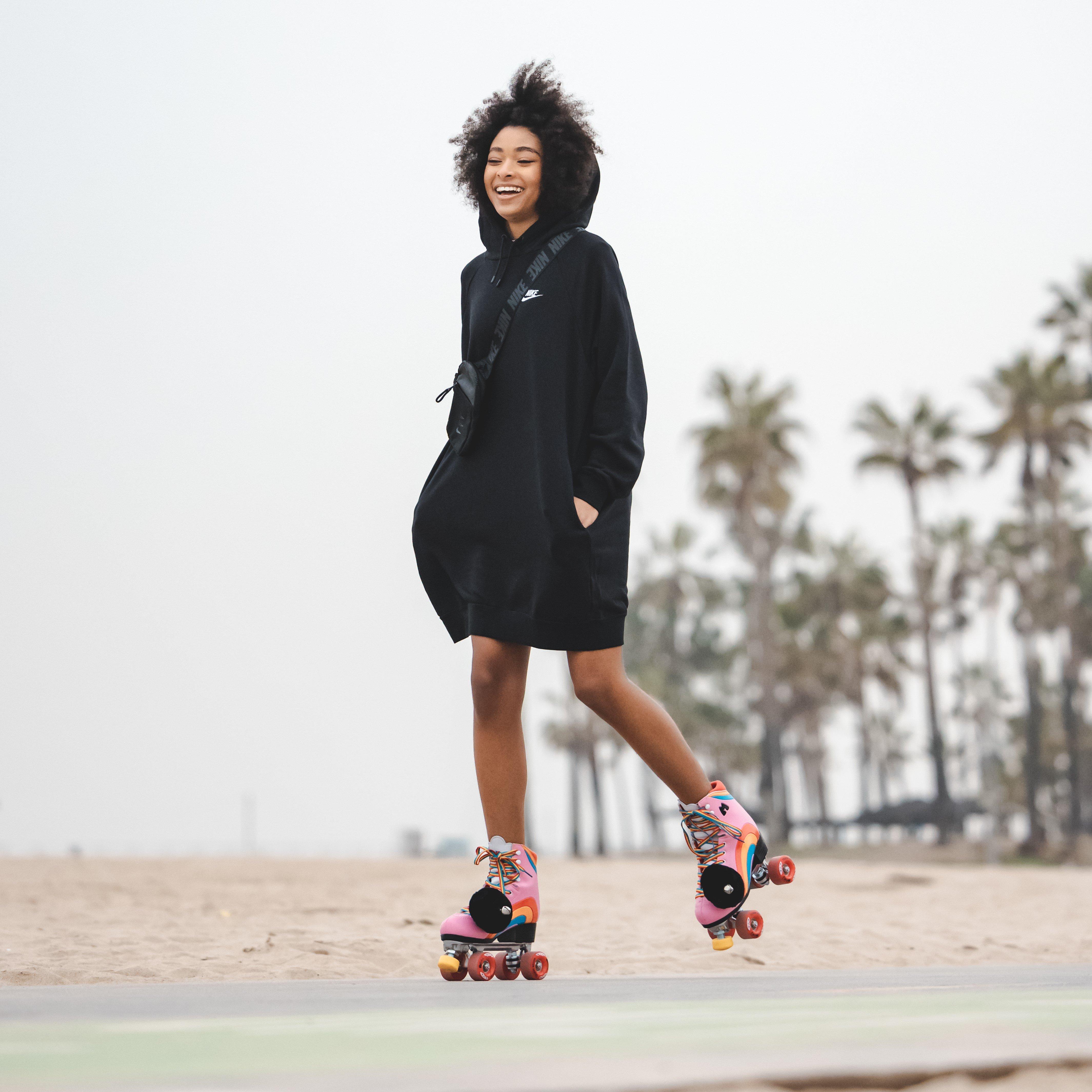 Mychal Bella on roller skates during Support Her Sole filming