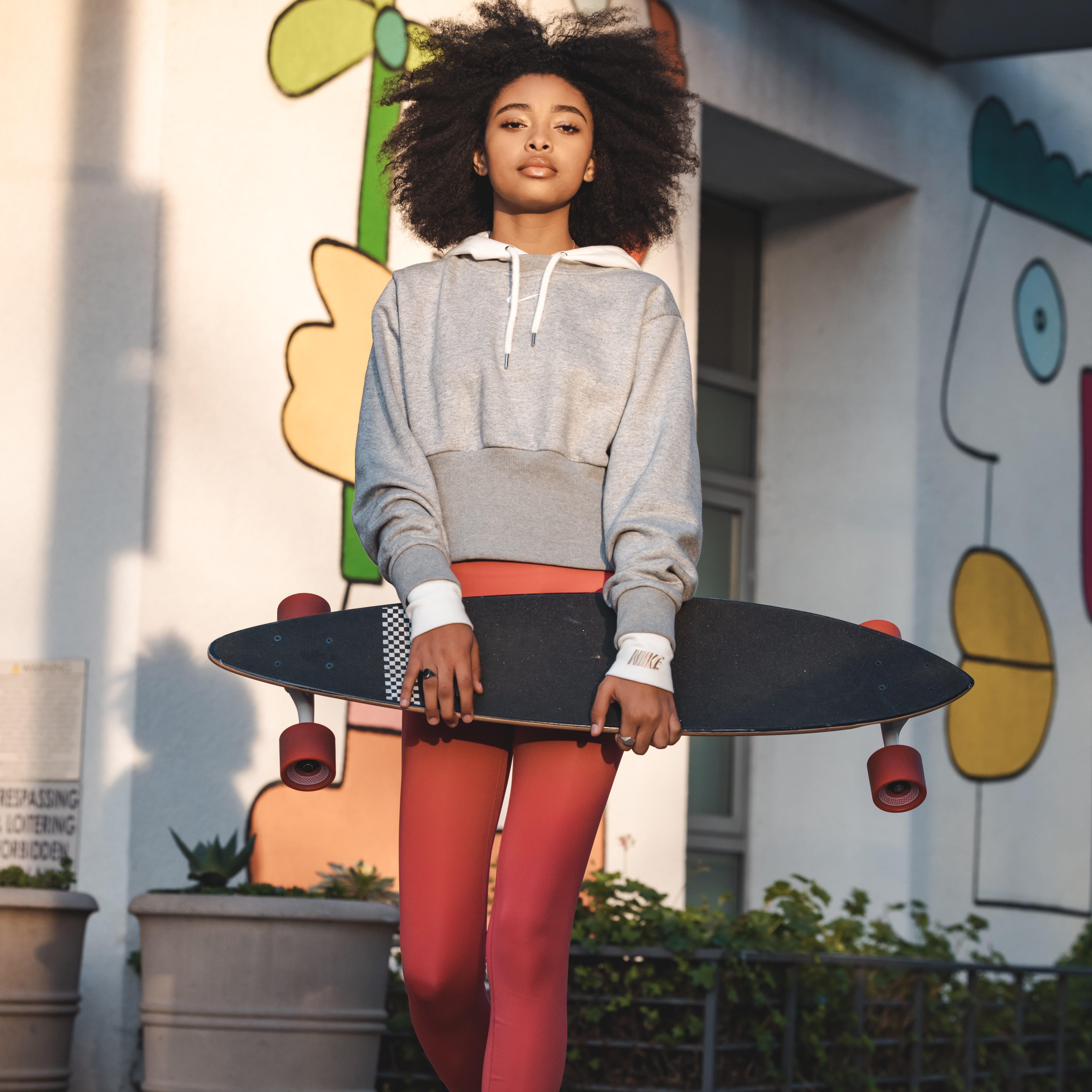 Mychal Bella Posing with skateboard for Support Her Sole