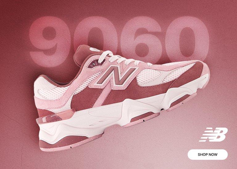  A promotional image for the New Balance 9060 sneaker in a pink and mauve colorway. The shoe features a chunky, layered design with mesh and suede panels, set against a matching dusty rose background. The number 9060 is displayed in large, faded typography behind the sneaker, with the New Balance logo in the top left corner.