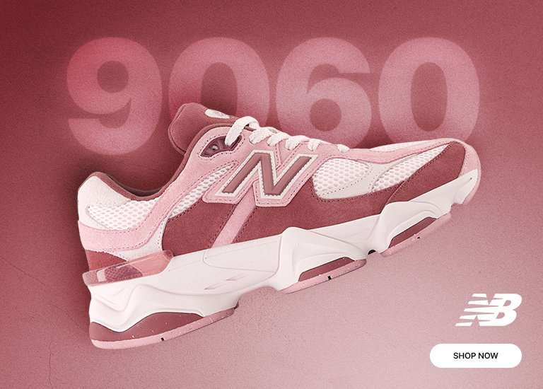 Pink-toned New Balance 960 shoe on pink/maroon background.