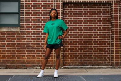 Accessorize for a Complete Look - Woman in baggy Nike Tee and Shorts